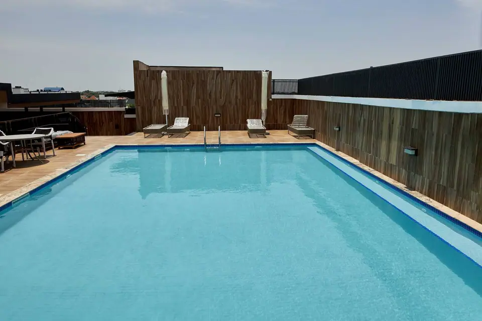 Rooftop swimming pool with sun loungers